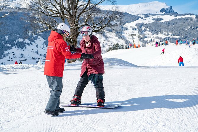 1-Day Beginner Snowboard Package in Grindelwald - Getting set up with board, boots, and helmet