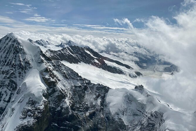 Private Swiss Alps helicopter tour over snow covered mountain peaks and glaciers - Interlaken between two lakes