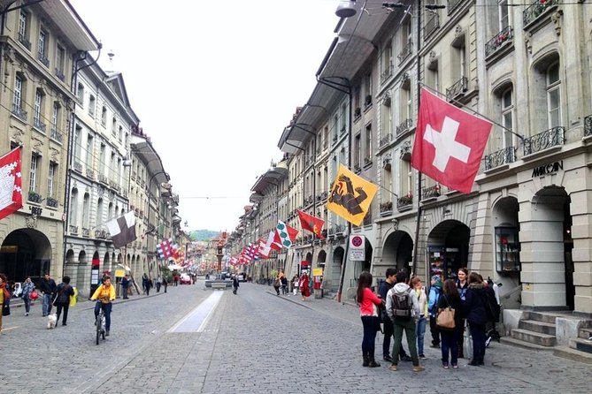 Private Swiss Cheese and Chocolate Tour from Interlaken - Gruyères village: medieval charm with a plate of cheese