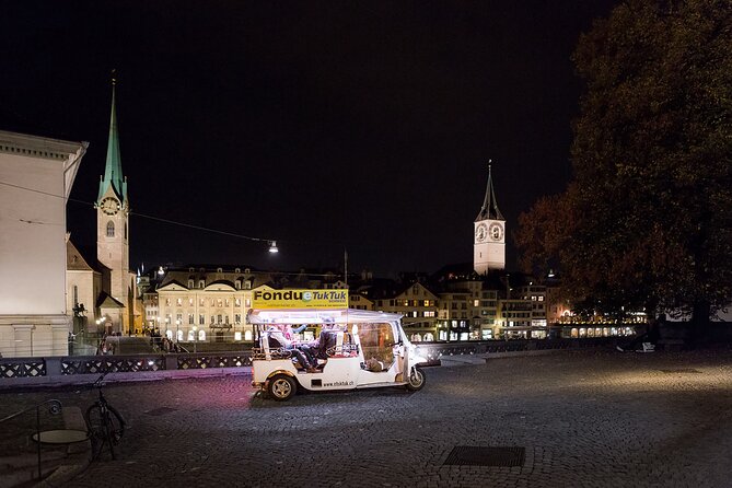 Zurich eTukTuk Private Tour - with Cheese Fondue and Wine - Fondue while the city moves past