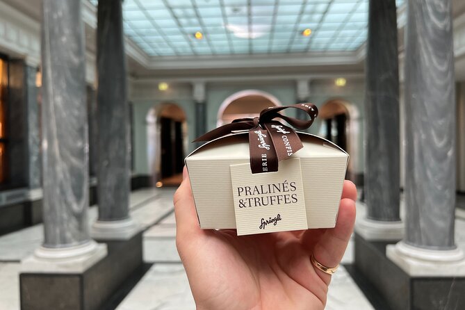Zurich Food Tour with 10 Local Delicacies, Cheeses & Chocolates - Fraumünster and St. Peter’s frame the next tastings